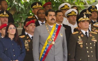 Nicolás Maduro with Cilia Flores and Padrino López at a 2017 Caracas parade.