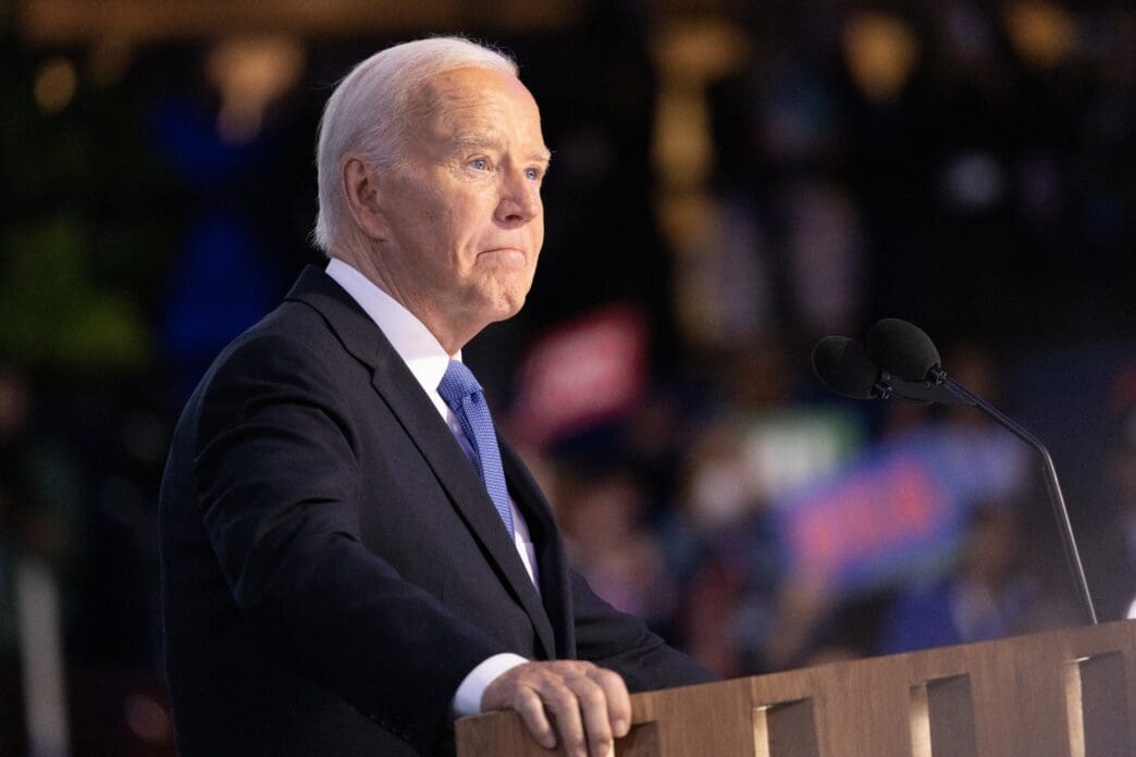Joe Biden stands at a podium at the 2024 Democratic National Convention in Chicago.