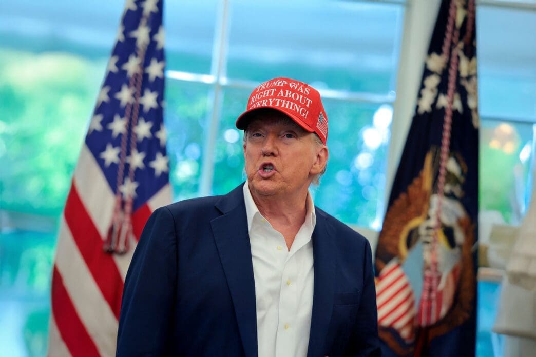 President Trump speaks in the Oval Office wearing a red cap that reads, "TRUMP WAS RIGHT ABOUT EVERYTHING."