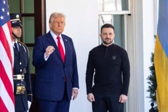 President Donald Trump and Ukrainian President Volodymyr Zelenskyy stand side-by-side at the White House during a formal meeting.