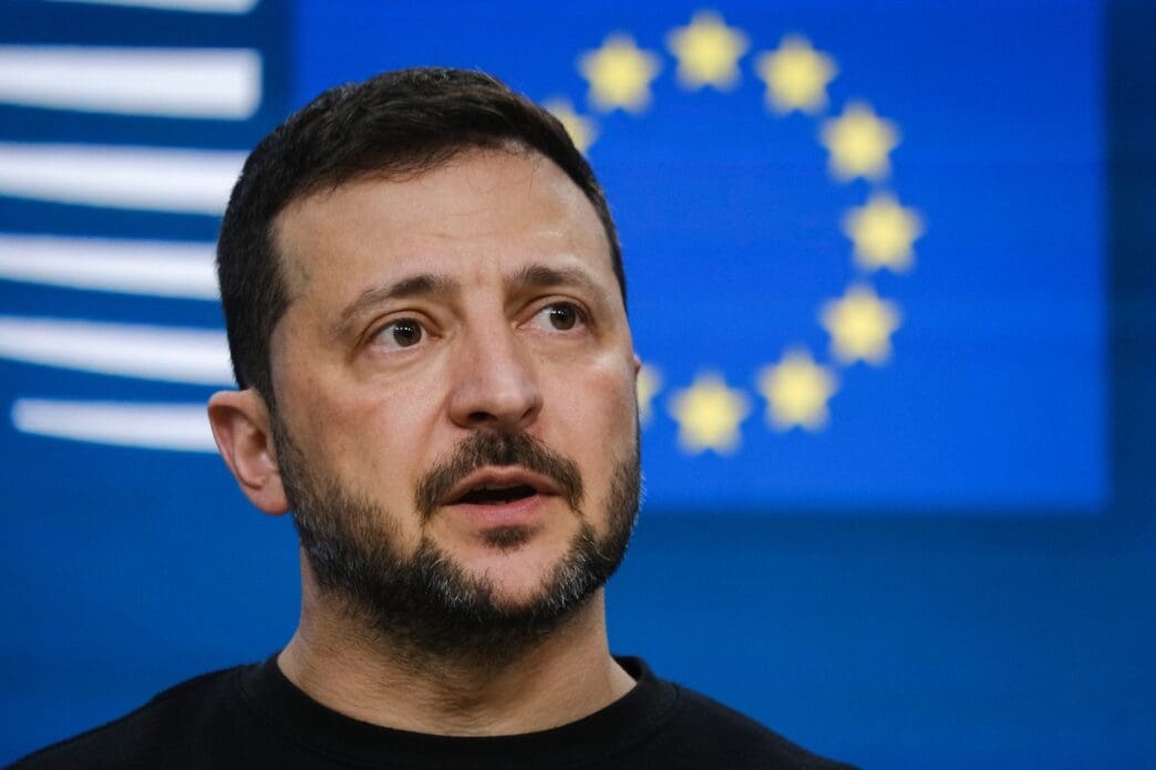Ukrainian President Volodymyr Zelenskyy speaks at a press conference with the EU flag behind him