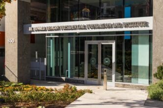The modern glass entrance to the Ronald Reagan Presidential Foundation and Institute in Washington DC.