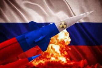 A nuclear missile painted in Russian colors flies in front of a Russian flag and a mushroom cloud.