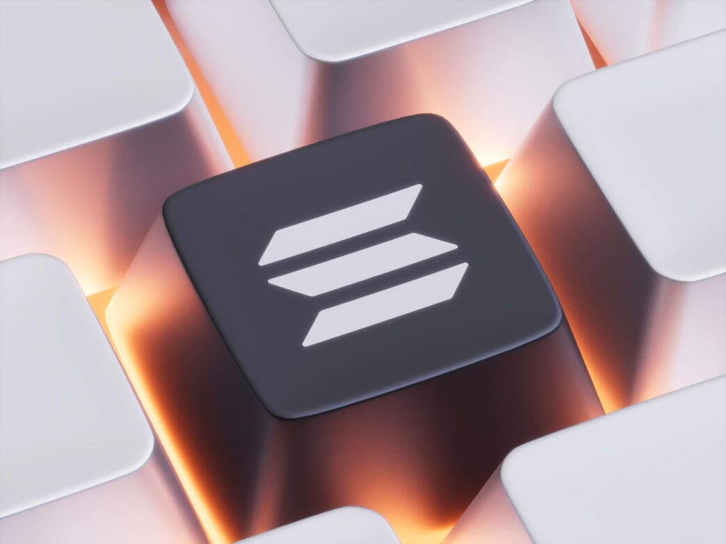 A close-up of a black computer keyboard key featuring the white Solana (SOL) cryptocurrency logo, glowing with an orange backlight.