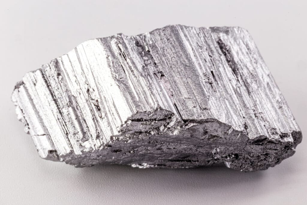 Close-up of raw neodymium metal. Rare earth magnets like this power the strongest, most efficient EV motors.