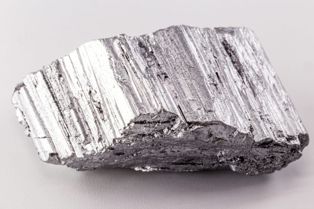 Close-up of raw neodymium metal. Rare earth magnets like this power the strongest, most efficient EV motors.