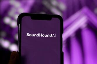 The SoundHound AI logo displayed on a smartphone screen with a purple abstract background.