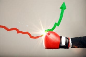 A red boxing glove punches a declining red stock arrow, turning it into a rising green arrow.