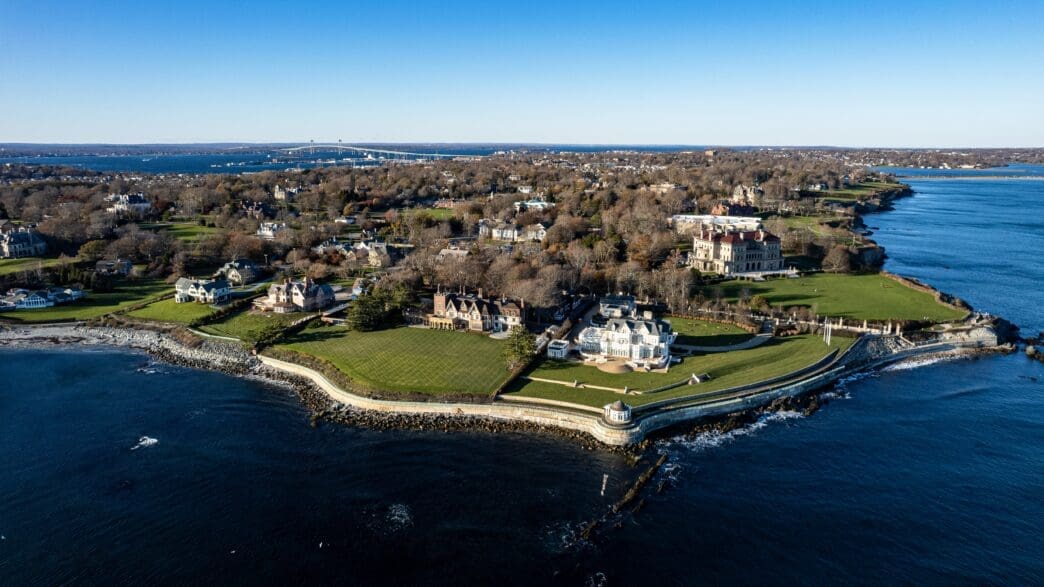 High-resolution drone photo of The Breakers mansion and other luxurious properties on the rocky coastline of Newport, Rhode Island.