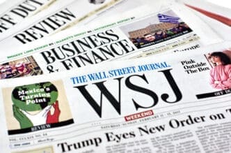 A stack of Wall Street Journal newspapers.