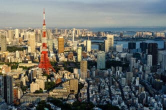 Aerial view of Tokyo cityscape featuring Tokyo Tower amidst dense buildings