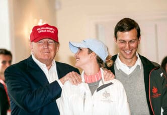 Donald Trump in a MAGA hat with his arm around a smiling Ivanka Trump and standing next to Jared Kushner.