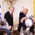 President Donald Trump waves to the press while Israeli Prime Minister Benjamin Netanyahu stands nearby during a joint White House news conference.