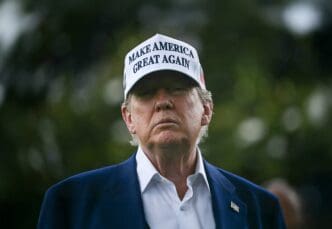 US President Donald Trump wearing a 'Make America Great Again' hat on June 18, 2025.