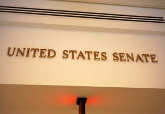 A sign on a wall in the US Capitol building reads "United States Senate".