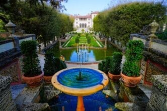 A fountain overlooks the long, formal gardens and reflecting pool of the Vizcaya Museum in Miami.