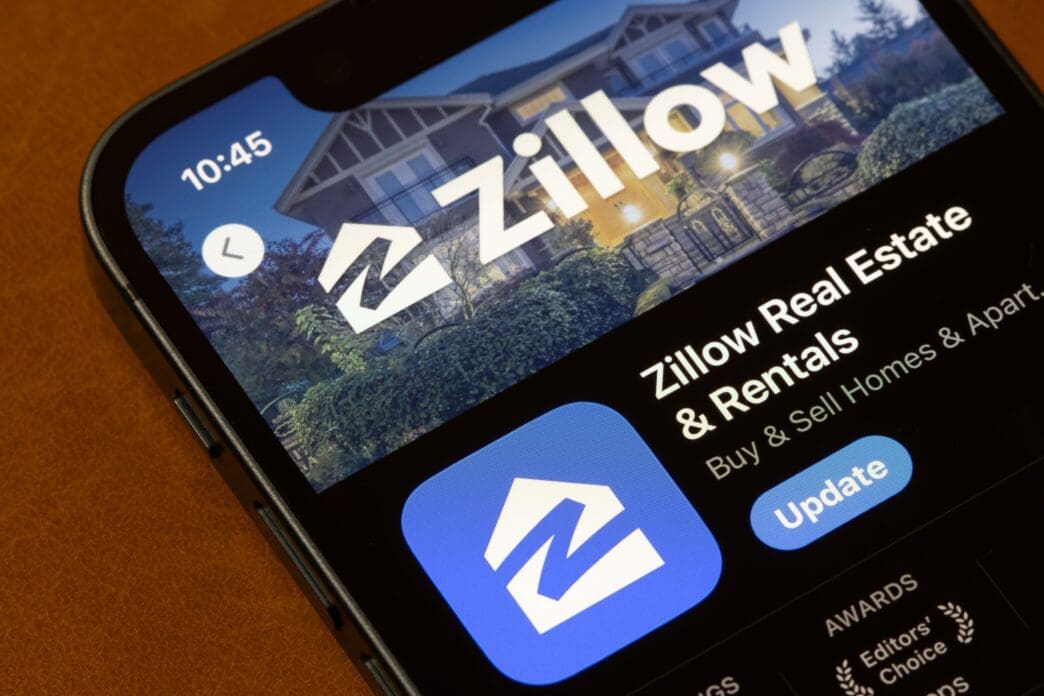 The Zillow Real Estate and Rentals app page is displayed on an iPhone in the App Store, showing the logo and an update button.