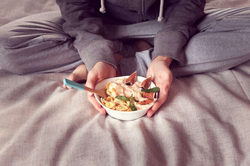 A close-up of a bowl of cereal with figs, likely part of a healthy breakfast.