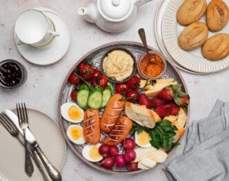 A breakfast or brunch tray features an assortment of foods, likely for a family meal.