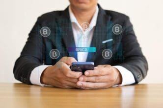 Illustration depicting the BRICS nations, possibly represented by flags or symbols, suggesting a new currency system for international trade.