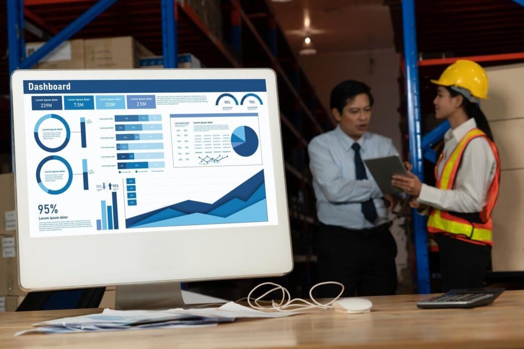 A business data dashboard displays key performance indicators and business intelligence analytics.