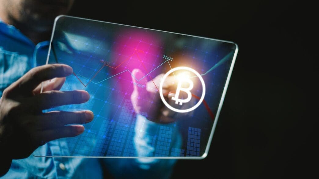 A businessman uses a tablet to connect to a global network, with a gold Bitcoin coin in flames, symbolizing growth.