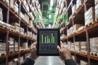 A businessman uses a digital tablet to display a warehouse management system with data visualizations.