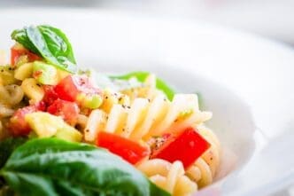 Close-up of fusilli pasta in a white bowl.
