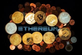 Close-up photo of various coins arranged on a dark surface.