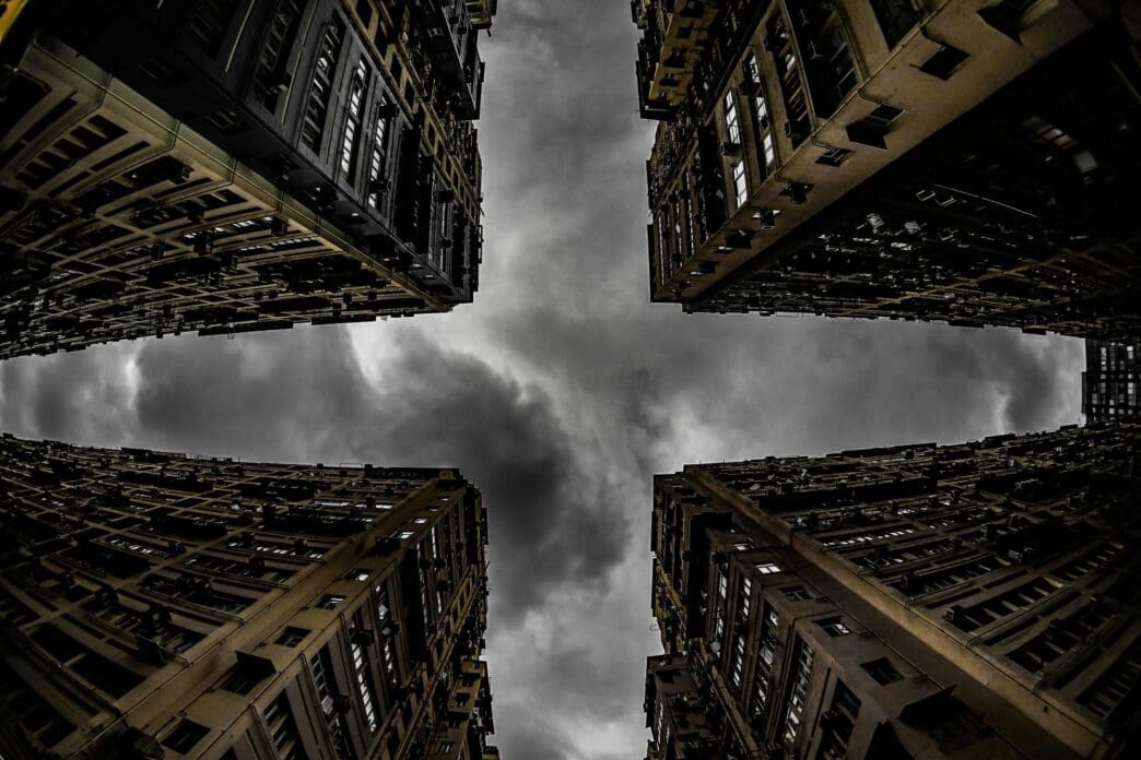 Low-angle shot of a contemporary building emphasizing its height and architecture.