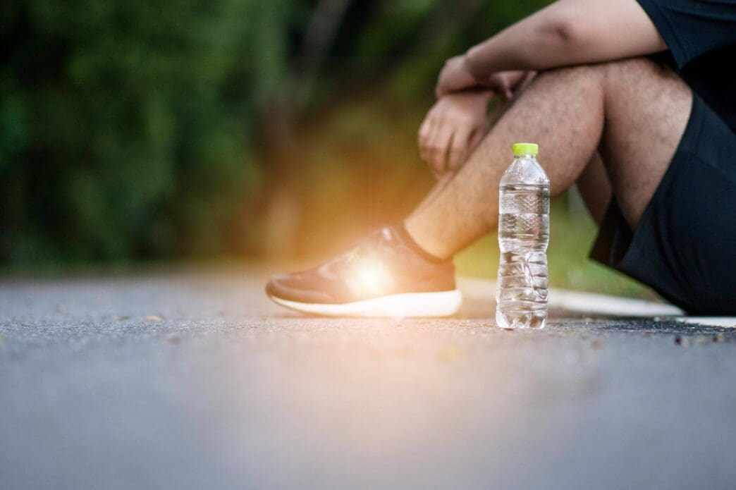 Close-up of a woman's hands holding a scoop of ice cream.