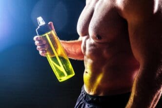 An antique statue of a muscular man with a six-pack, resembling the Greek god Apollo, drinks water from a bottle against a black background.