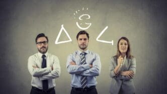 A group of people are gathered, likely for a meeting or presentation, possibly discussing or reviewing life insurance documents.