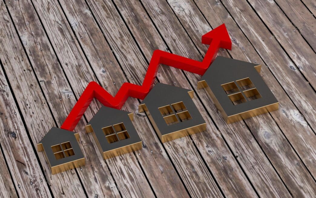 A 3D rendering depicts a rising bar graph illustrating real estate growth.