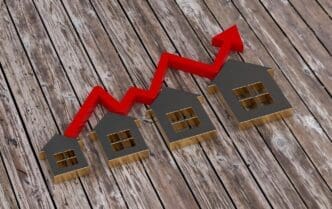 A 3D rendering depicts a rising bar graph illustrating real estate growth.