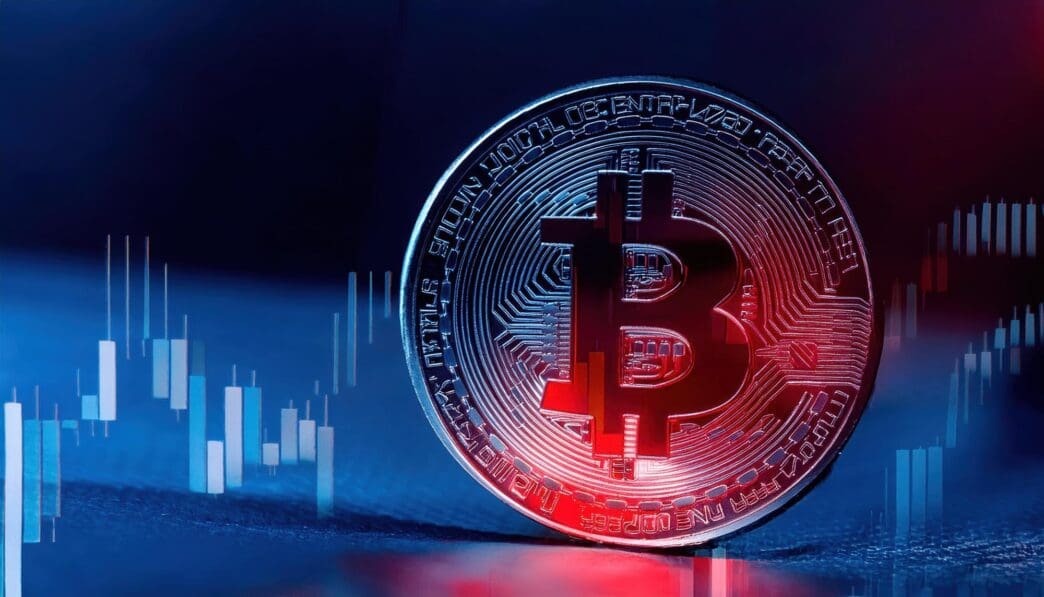 Red light illuminates a Bitcoin symbol, symbolizing declining prices and market uncertainty.