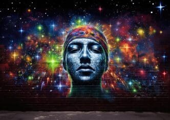 Street art depicts an astronomer on a brick wall, surrounded by colorful galaxies.