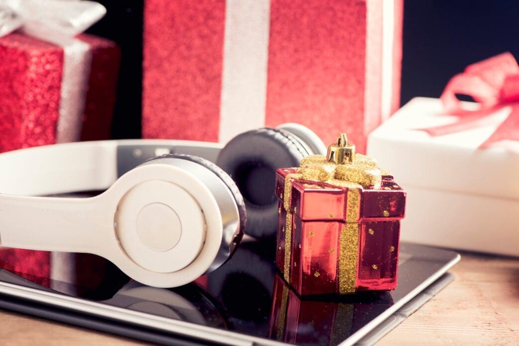 A tablet and headphones are displayed as suggested Christmas gifts.