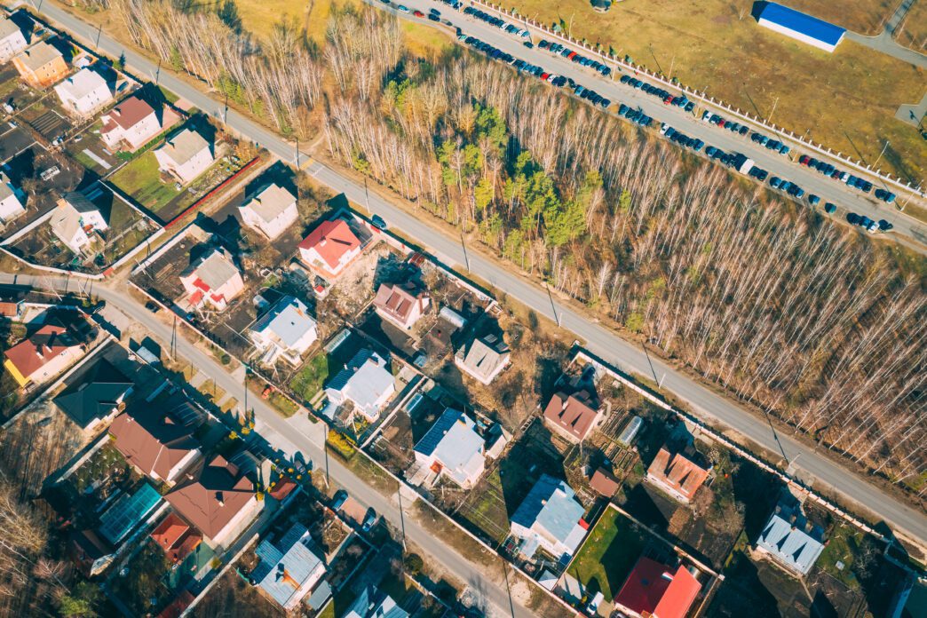 High-angle view of various buildings densely packed together in a city.