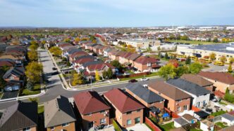 Aerial view of a dense suburban neighborhood near Toronto, Canada, during the fall season.