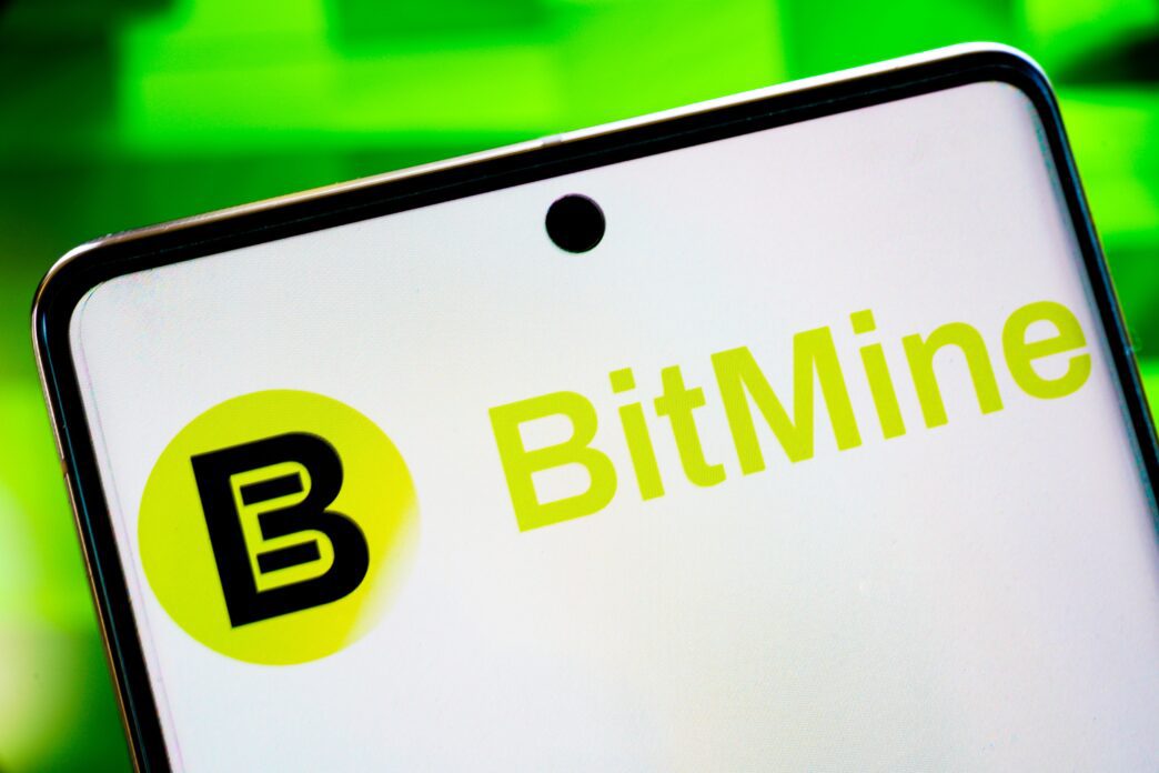 Close-up of a smartphone screen displaying the green and black "BitMine" logo against a white background.