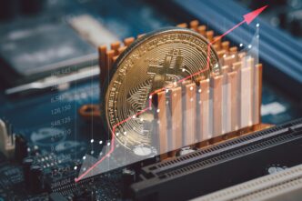 Gold Bitcoin coin on a computer motherboard with an overlaid rising red financial graph.