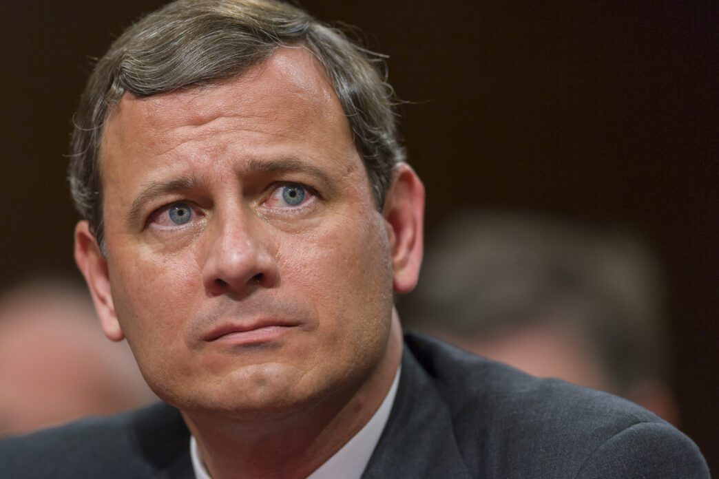 Close-up portrait of the Chief Justice of the United States, John Roberts, looking forward.