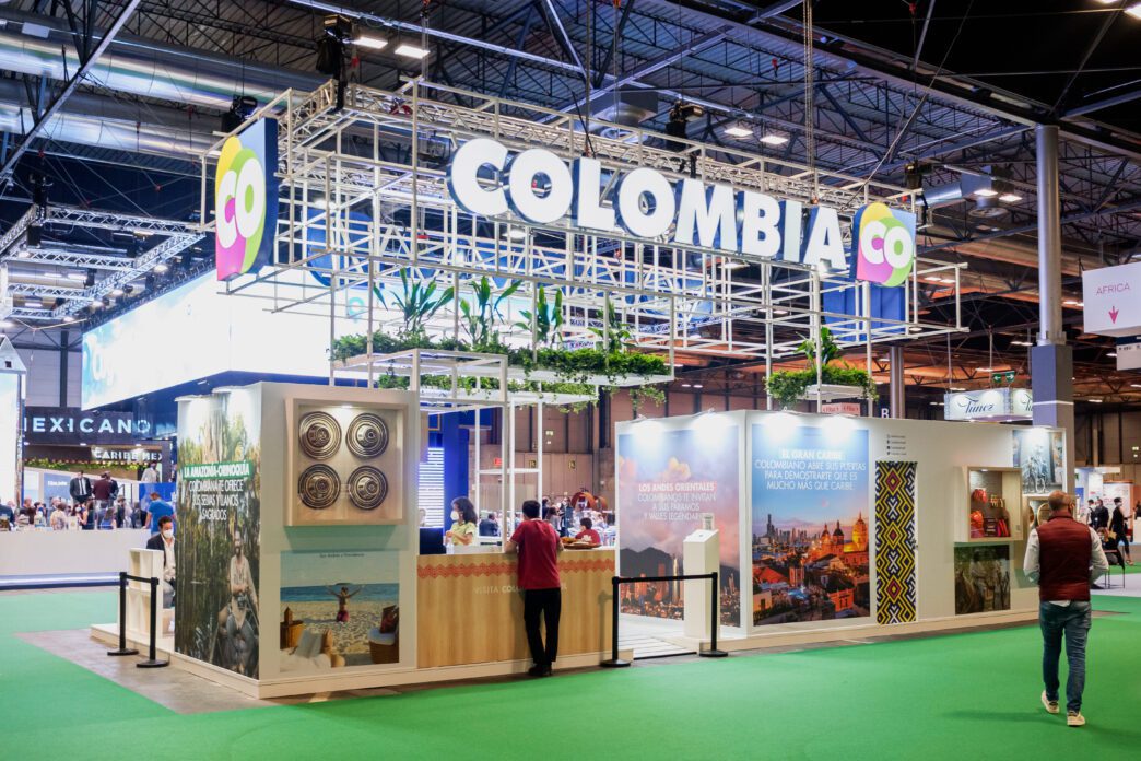 Large, modern promotional stand for Colombia at the Fitur travel exhibition in Madrid.