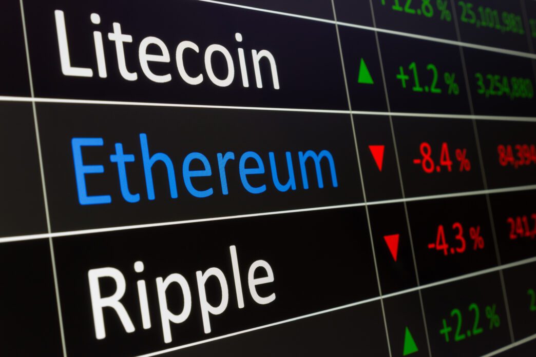 Digital trading screen displaying crypto tickers Litecoin, Ethereum, and Ripple with associated price changes.