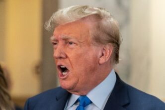 Close-up of Donald Trump speaking forcefully to the press before a civil fraud trial.