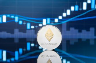 Silver Ethereum coin centered over a blue background displaying a rising candlestick chart.