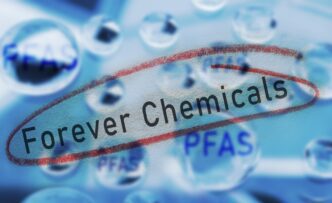 The term "Forever Chemicals" circled in red, with water drops containing the acronym "PFAS."