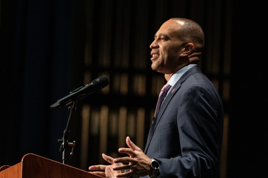 Congressman Hakeem Jeffries speaking passionately at a podium during an event.