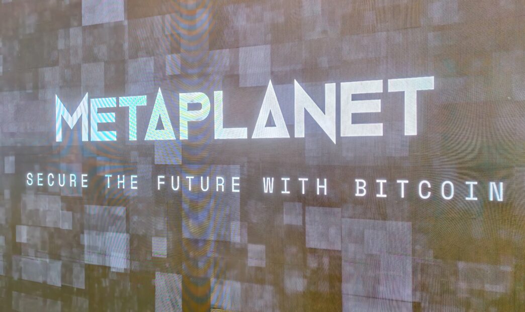 Digital display showing the Metaplanet logo and the slogan "Secure the Future with Bitcoin."
